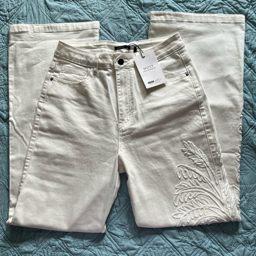White soft denim pants with one side embroidered